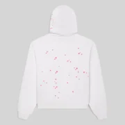 Back view of the white SP5DER Fractured Logo hoodie featuring a scattered hot pink star print on the back and hood.