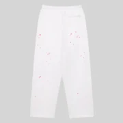 Back view of white SP5DER Fractured Logo wide leg sweatpants featuring scattered pink star print graphics.