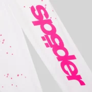 Close up of the SP5DER white sweatpants featuring a bold pink fractured logo and scattered star print detailing.