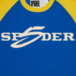 Close up view of the blue Sp5der 5uki Tee with yellow collar and white graphic logo branding on the chest area