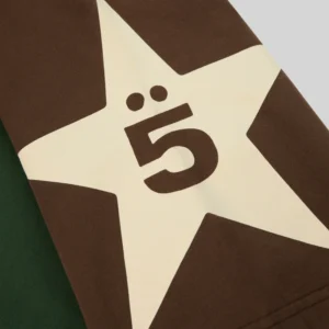 Close-up view of the Sp5der 5uki Tee featuring a distinctive star logo graphic print on the cotton streetwear sleeve.