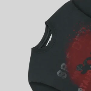 Close up detail of the black Sp5der Standard Issue tee featuring the signature distressed red graphic print on front.