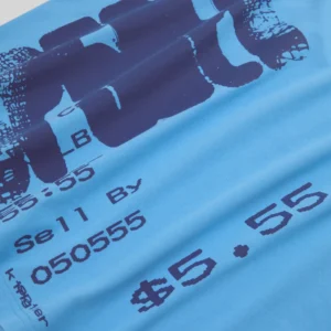 Close up of the Sp5der Commerce Tee in blue featuring a bold dark graphic print with lettering and dollar signs.