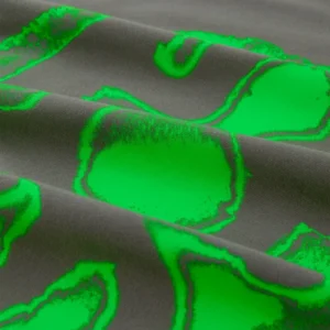 Close up of the vibrant green abstract fingerprint graphic on the dark gray cotton Sp5der Fingerprint Tee fabric.