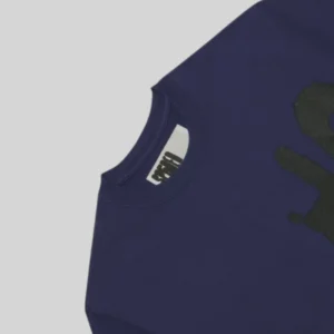 Close up view of the dark blue Sp5der SP5 5Luminum Tee showing the premium cotton fabric and brand neck label