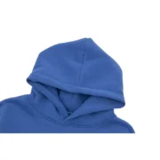 Close-up view of the Sp5der Acai Hoodie in a vibrant navy blue colorway, highlighting the premium hood detail.