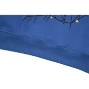 Close up view of the navy blue Sp5der Acai hoodie showcasing the high-quality fabric and iconic graphic print details.