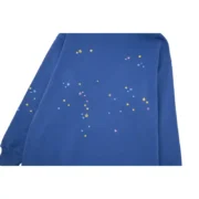 Close-up of the Navy Blue Sp5der Acai Hoodie showcasing the unique and colorful star graphic print on the fabric.