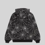 Back view of the black Sp5der All Over Print Hoodie featuring a detailed white embroidered web design throughout.