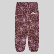 Brown Sp5der All Over Print sweatpant with embroidered web design and logo on the leg, front view of streetwear joggers.