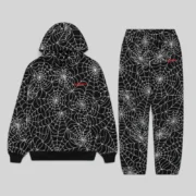 Black Sp5der All-Over Print Tracksuit featuring an embroidered web design and branded logo on the hoodie and pants.
