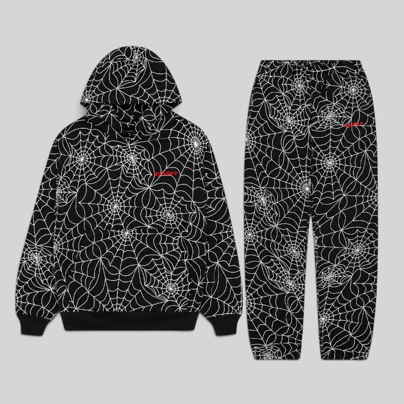 Black Sp5der All-Over Print Tracksuit featuring an embroidered web design and branded logo on the hoodie and pants.