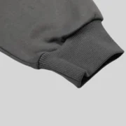 A close-up view of the premium 13oz cotton fleece fabric texture on the Sp5der Archive Contrast Hoodie in Slate Grey.