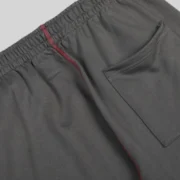 Close-up detail of the Slate Grey Sp5der Archive Contrast Sweatpants showing the fabric texture and stitching.