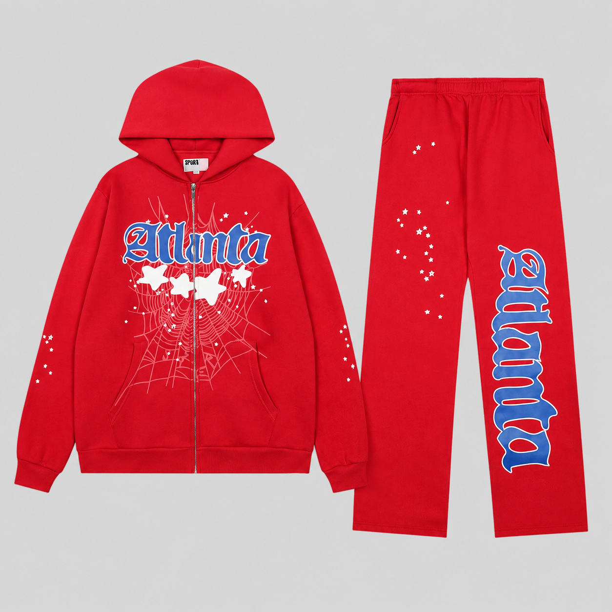 Red Sp5der Atlanta tracksuit featuring a zip-up hoodie and open-leg sweatpants with graphic star and script branding.