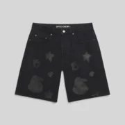 Front view of the black Sp5der Beluga denim shorts featuring signature star and spider print design details.