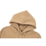 Close-up view of the hood detail on a premium Light-Brown Sp5der Beluga Hoodie with quality fabric construction.