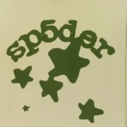 Close-up view of the Sp5der Beluga long-sleeve shirt in tan with a green branded graphic print and star details.