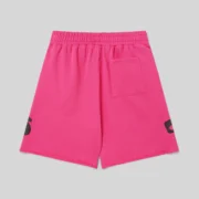 Back view of the vibrant pink Sp5der Beluga Sweatshorts from the SS26 streetwear collection with a back pocket.