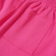 Close-up view of the premium pink cotton fabric and pocket detail on the Sp5der Beluga Sweatshorts from the SS26 line.