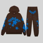 Sp5der Beluga V2 Tracksuit in Brown featuring a matching pullover hoodie and joggers with blue graphic star details.