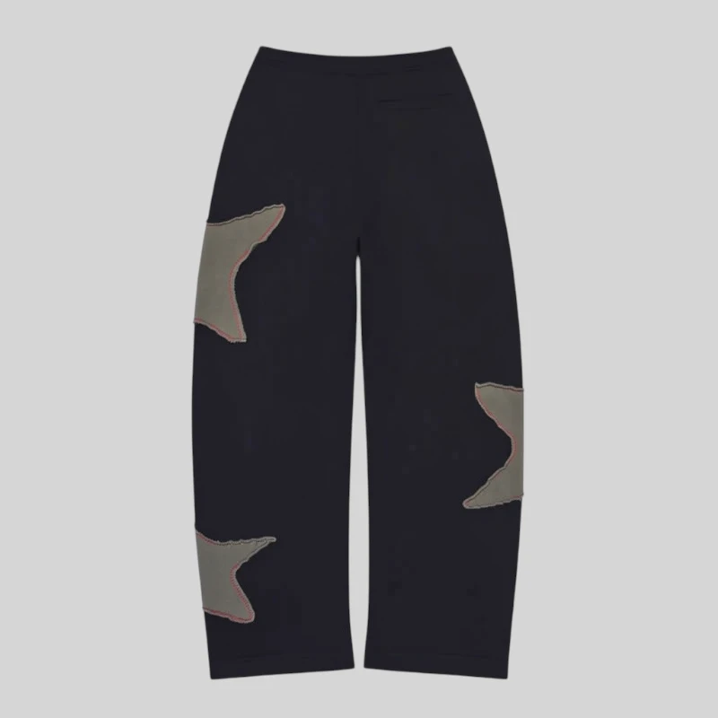 Sp5der Big Star Black Wide Leg Sweatpants with frayed star patches, back view showing the 13oz cotton fleece design.