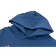 Close-up view of the premium navy-blue Sp5der cropped hoodie focusing on the detailed hood construction and fabric.