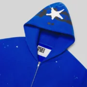 Close-up view of the interior tag and hood detail of the Tory Blue Sp5der Heavy Web full zip cotton fleece hoodie.