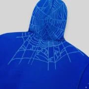 Close-up view of the Sp5der Heavy Web Full Zip Hoodie in Tory Blue, highlighting the signature web hood design.