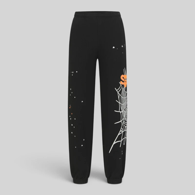 Front view of the Sp5der Heavy Web sweatpants in black, featuring a signature spider web graphic and scattered star print.