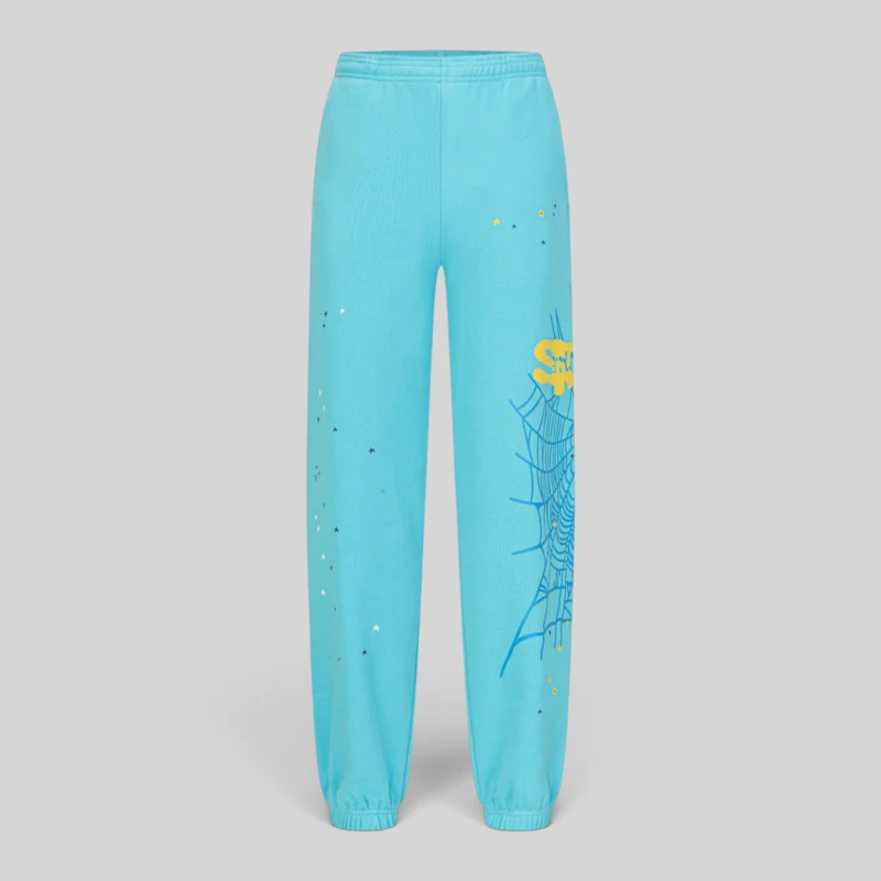 Sp5der Heavy Web Sweatpants Sky Blue Front View Front view of Sp5der Heavy Web sweatpants in sky blue color featuring a web graphic and star print details.
