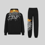 Back view of the black Sp5der Heavy Web tracksuit featuring signature white web graphics and orange puff print accents.
