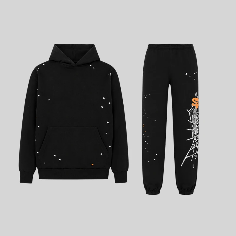Front view of the black Sp5der Heavy Web tracksuit featuring a hoodie and sweatpants with star and web graphic prints.