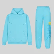 Front view of the Sp5der Heavy Web Tracksuit in sky blue featuring star graphics and signature web print on 13oz cotton.