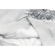 Close-up view of the premium grey Sp5der I Heart SP5 souvenir hoodie showing the high-quality fabric and web graphic.
