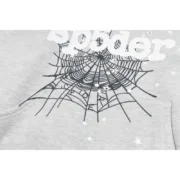 Close-up view of the Sp5der I Heart SP5 Souvenir Hoodie in grey showing the iconic black web graphic and branding.