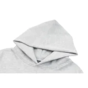 Close-up view of the hood detail on the gray Sp5der I Heart SP5 Souvenir Hoodie featuring a high-quality fabric texture.