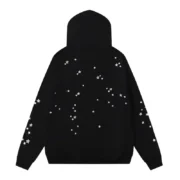 Back view of the black Sp5der Jeffery hoodie featuring a unique star pattern design, showcasing urban street style.