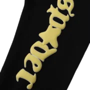 Close-up view of the Sp5der Jeffery Sweatpant in black, highlighting the detailed, high-quality urban graphic print.
