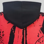 Closeup view of the Sp5der JP5 Moto Hoodie in black featuring painted moto graphic design details on the fabric.