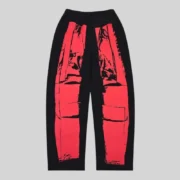 Back view of black Sp5der JP5 Moto Sweatpants with red motocross-inspired graphic print from the FW25 streetwear collection.