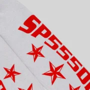 Close-up view of the Sp5der Mx555 Heather Grey sweatpants featuring the iconic red foil logo and star print design.