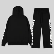 Back view of the black Sp5der Mx555 zip tracksuit with signature graphic print on the hoodie sleeves and track pants