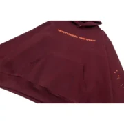 Close up view of the maroon Sp5der Nocturnal Highway hoodie featuring orange text and high quality distressed print.