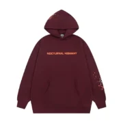 Front view of the Sp5der Nocturnal Highway Hoodie in a maroon colorway featuring premium fabric and relaxed fit style.
