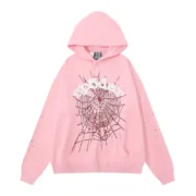 Front view of the Sp5der OG Web Hoodie in a vibrant pink colorway with iconic web graphic and premium fleece design