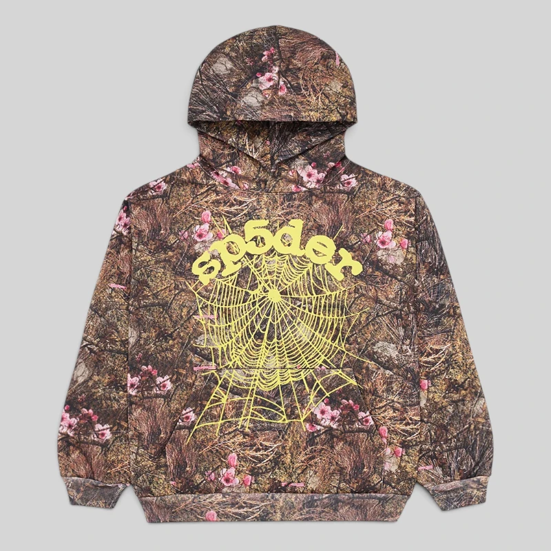 Sp5der OG Web Real Tree Hoodie Front View Front view of the brown Sp5der OG Web Real Tree hoodie featuring yellow logo puff print and pink floral camo pattern.