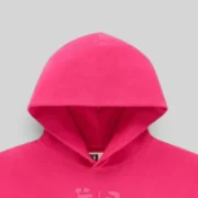 Close-up view of the hood on the Sp5der OG Web Ombre Hoodie in vibrant pink cotton fleece with signature detailing.