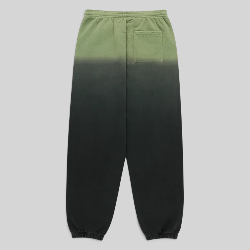 Back view of Sp5der OG Web Ombre Sweatpants in Black featuring a green and black gradient cotton fleece design.