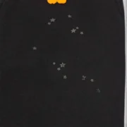 Close-up view of the black Sp5der OG Web V2 Knicks Alternate sweatpants showing the iconic star graphic detail.